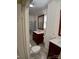 Stylish bathroom with double vanity, marble countertops, and a glass-enclosed shower at 514 N Main St, Mount Gilead, NC 27306