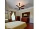 Spacious bedroom showcasing vintage dressers, ceiling fan, and ample natural light at 514 N Main St, Mount Gilead, NC 27306