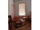 Cozy bedroom with hardwood floors, a classic rug, and natural light from the window at 514 N Main St, Mount Gilead, NC 27306