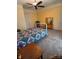 Cozy bedroom with vintage furniture, ceiling fan, and neutral carpet at 514 N Main St, Mount Gilead, NC 27306