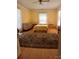 Bright bedroom with neutral walls and wood laminate flooring at 514 N Main St, Mount Gilead, NC 27306