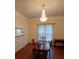 Traditional dining room with hardwood floors, chandelier, fireplace, and ample natural light at 514 N Main St, Mount Gilead, NC 27306