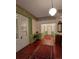 Entryway featuring hardwood floors, decorative wall trim, and classic details at 514 N Main St, Mount Gilead, NC 27306