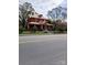 Brick home with a welcoming front porch and ample greenery, offering a serene curb appeal at 514 N Main St, Mount Gilead, NC 27306