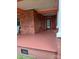 Wide covered front porch with classic brick accents and an inviting entrance at 514 N Main St, Mount Gilead, NC 27306