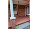 Front porch view with brick columns and porch doors at 514 N Main St, Mount Gilead, NC 27306