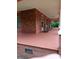 Spacious front porch, enhanced by brick accents and covered roof at 514 N Main St, Mount Gilead, NC 27306
