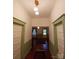 Bright hallway with decorative trim, multiple doors, and hardwood floors at 514 N Main St, Mount Gilead, NC 27306