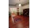 Spacious living room featuring hardwood floors, rug, built-in bookshelves, and classic details at 514 N Main St, Mount Gilead, NC 27306