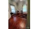 Inviting living room with hardwood floors, a decorative rug, and plenty of natural light at 514 N Main St, Mount Gilead, NC 27306