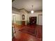 Spacious living room featuring hardwood floors, rug, built-in bookshelves, and classic details at 514 N Main St, Mount Gilead, NC 27306