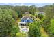 This home offers a pool, spa, outdoor kitchen, and multiple outdoor living spaces at 5418 Commodore Pl, Clover, SC 29710