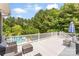 Enjoy scenic views from this home's back deck, overlooking the private pool and lush greenery at 5418 Commodore Pl, Clover, SC 29710