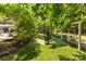 Relax in this enchanting backyard oasis with manicured lawn and peaceful shade at 5418 Commodore Pl, Clover, SC 29710