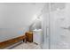 Cozy bathroom with a tiled shower, sleek vanity, and a warm wood bench for added comfort at 5418 Commodore Pl, Clover, SC 29710