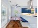 Cozy breakfast nook with custom seating, bright windows, and stylish blue accents at 5418 Commodore Pl, Clover, SC 29710