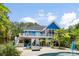 Relax in the spacious backyard with a beautiful blue home overlooking the pool and spa at 5418 Commodore Pl, Clover, SC 29710