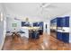 Bright and airy kitchen with blue cabinetry, a center island, and a cozy breakfast nook at 5418 Commodore Pl, Clover, SC 29710