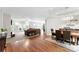 Open-concept living room with hardwood floors, neutral walls, and plenty of natural light at 5418 Commodore Pl, Clover, SC 29710