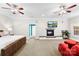 Expansive main bedroom with a fireplace, ceiling fans, and sitting area at 5418 Commodore Pl, Clover, SC 29710
