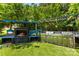 This amazing outdoor kitchen features a built-in grill and cozy fireplace at 5418 Commodore Pl, Clover, SC 29710