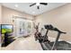 Home workout room with an elliptical, treadmill, television, and French doors to the exterior at 5418 Commodore Pl, Clover, SC 29710