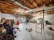 Unfinished basement with concrete floors, exposed ceiling, and access to the exterior at 55 Dixie Dr, Taylorsville, NC 28681