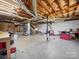 Unfinished basement with exposed ceiling, concrete floors, and visible ductwork, offering potential for customization at 55 Dixie Dr, Taylorsville, NC 28681