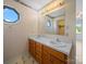 A bathroom vanity has double sinks and wood drawers, with an elegant mirror above at 55 Dixie Dr, Taylorsville, NC 28681