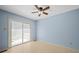 Bedroom with sliding glass doors to deck and ceiling fan at 55 Dixie Dr, Taylorsville, NC 28681