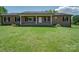 Charming single-story brick home with a well-manicured front yard and covered porch at 55 Dixie Dr, Taylorsville, NC 28681