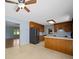 Open kitchen featuring wood cabinets, neutral countertops and stainless-steel appliances at 55 Dixie Dr, Taylorsville, NC 28681