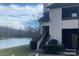 A beautiful building exterior with a well-maintained lawn and scenic water view at 5718 Dockside Dr, Charlotte, NC 28227