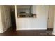 Inviting living room with neutral walls and a convenient pass-through to the kitchen, ready for personal touches at 5718 Dockside Dr, Charlotte, NC 28227