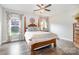 Comfortable bedroom with a four-poster bed, wood floors and ample natural light at 6309 Fawn Crest Dr, Waxhaw, NC 28173