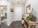 Inviting entryway featuring hardwood floors, a wooden console table, and stylish decor at 6309 Fawn Crest Dr, Waxhaw, NC 28173