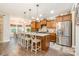 Spacious kitchen with a large island, stainless steel appliances, and modern lighting at 6309 Fawn Crest Dr, Waxhaw, NC 28173