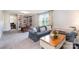 Comfortable living room with a built-in bookcase, a wooden desk, and cozy furniture at 6309 Fawn Crest Dr, Waxhaw, NC 28173