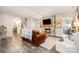 Spacious living room with stone fireplace, hardwood floors, and open view to the foyer at 6309 Fawn Crest Dr, Waxhaw, NC 28173