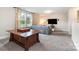 Inviting living room with a spacious layout, comfortable seating, and bright natural light at 6309 Fawn Crest Dr, Waxhaw, NC 28173