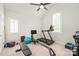 Bedroom featuring a treadmill, elliptical, and gym equipment at 6831 Conservatory Ln, Charlotte, NC 28210