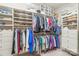 Walk-in closet with built-in shelving, hanging rods, drawers, and organized storage solutions for shoes, clothes, and accessories at 6831 Conservatory Ln, Charlotte, NC 28210