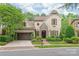 Charming home with stone accents, lush landscaping, and a pergola-covered garage in a desirable neighborhood at 6831 Conservatory Ln, Charlotte, NC 28210