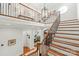 Welcoming foyer featuring staircase and a chandelier at 6831 Conservatory Ln, Charlotte, NC 28210