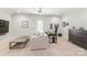 Bright home office with neutral walls, carpet, stylish desk, comfortable seating, and a ceiling fan at 6831 Conservatory Ln, Charlotte, NC 28210