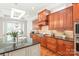 Bright kitchen with custom cabinetry, granite countertops, and stainless steel appliances; perfect for cooking at 6831 Conservatory Ln, Charlotte, NC 28210