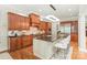 Spacious kitchen features custom cabinetry, granite countertops, a large island, and stainless steel appliances at 6831 Conservatory Ln, Charlotte, NC 28210