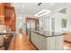 Gourmet kitchen with a large granite island, custom cabinetry, and stainless steel appliances perfect for entertaining at 6831 Conservatory Ln, Charlotte, NC 28210