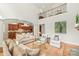 Open-concept living room that seamlessly connects to a bright kitchen with stainless steel appliances and granite countertops at 6831 Conservatory Ln, Charlotte, NC 28210