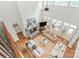 Bright living room with fireplace, hardwood floors, high ceilings, and an abundance of natural light at 6831 Conservatory Ln, Charlotte, NC 28210